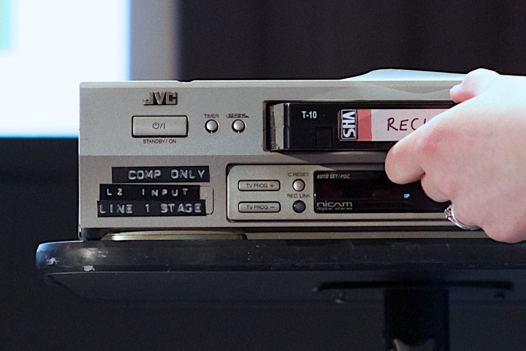 analog media vhs tapes being inserted to VCR